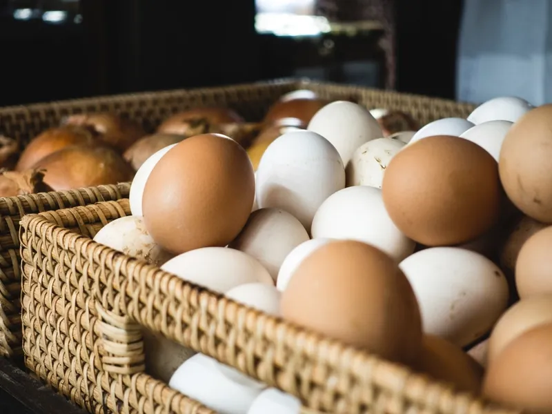 A basket of brown and white eggs